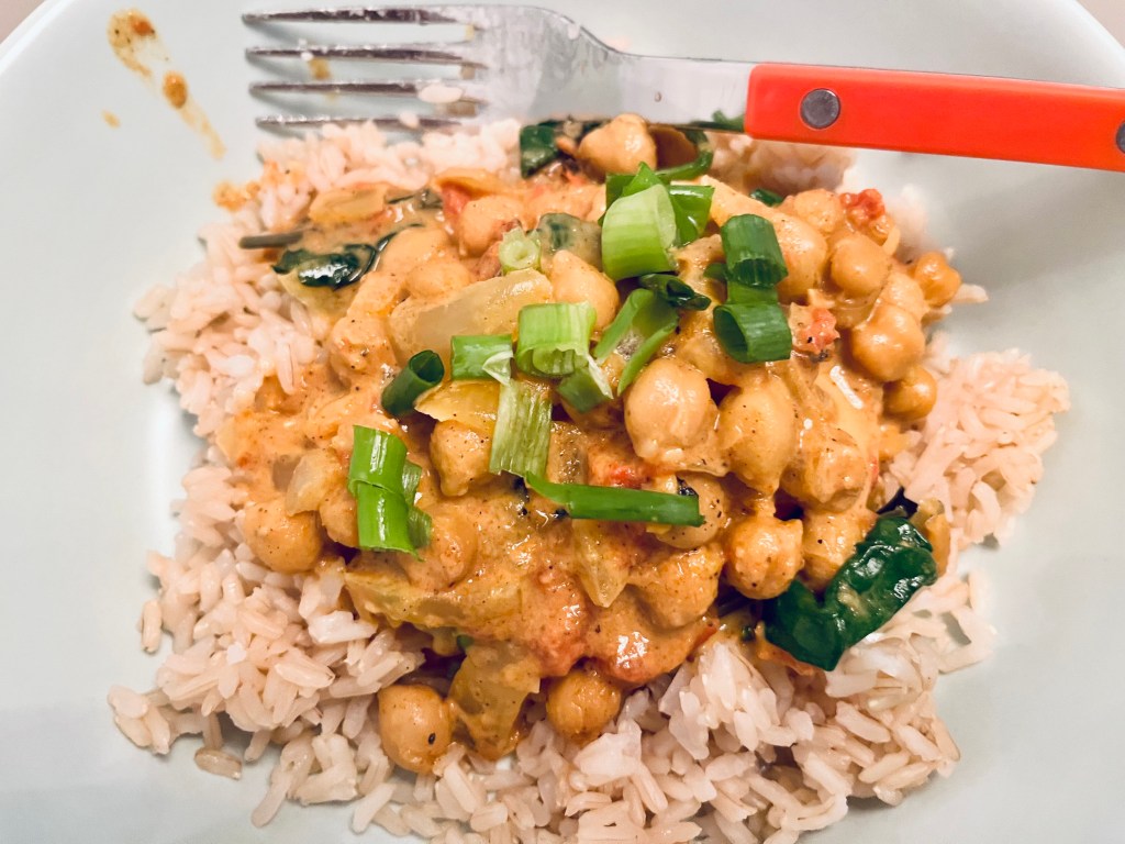 Chickpea tikka masala over brown rice.