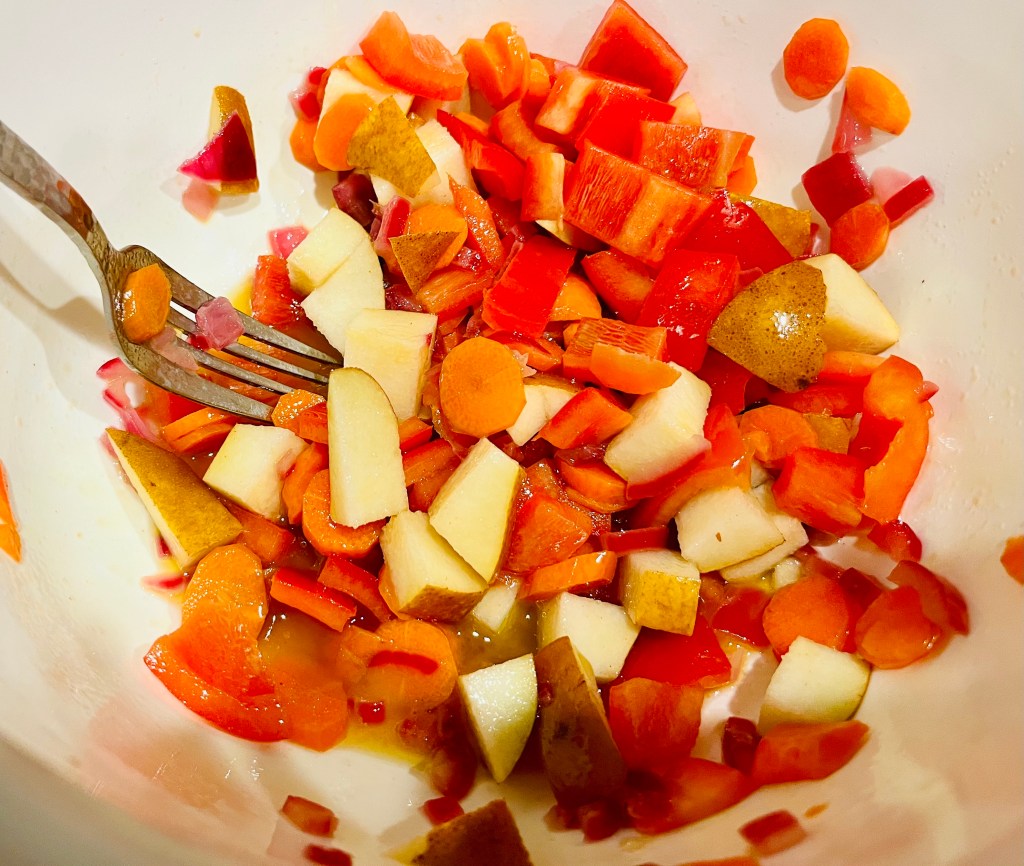 Adding the veggie and pear scraps.