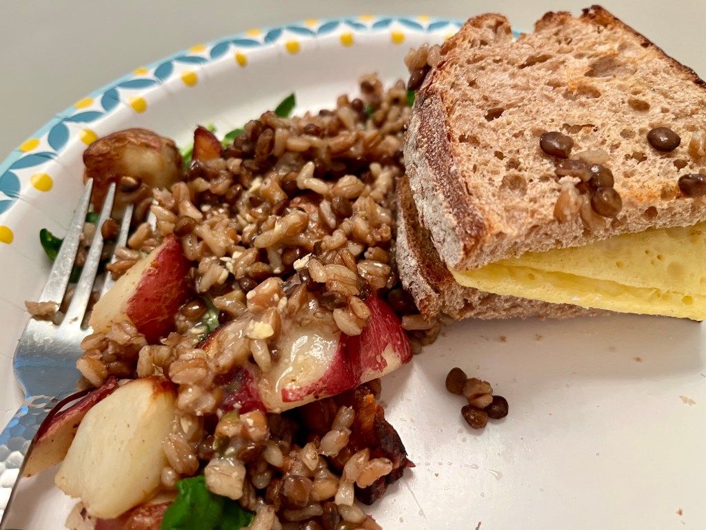 Arugula with rice, lentils, egg sandwich