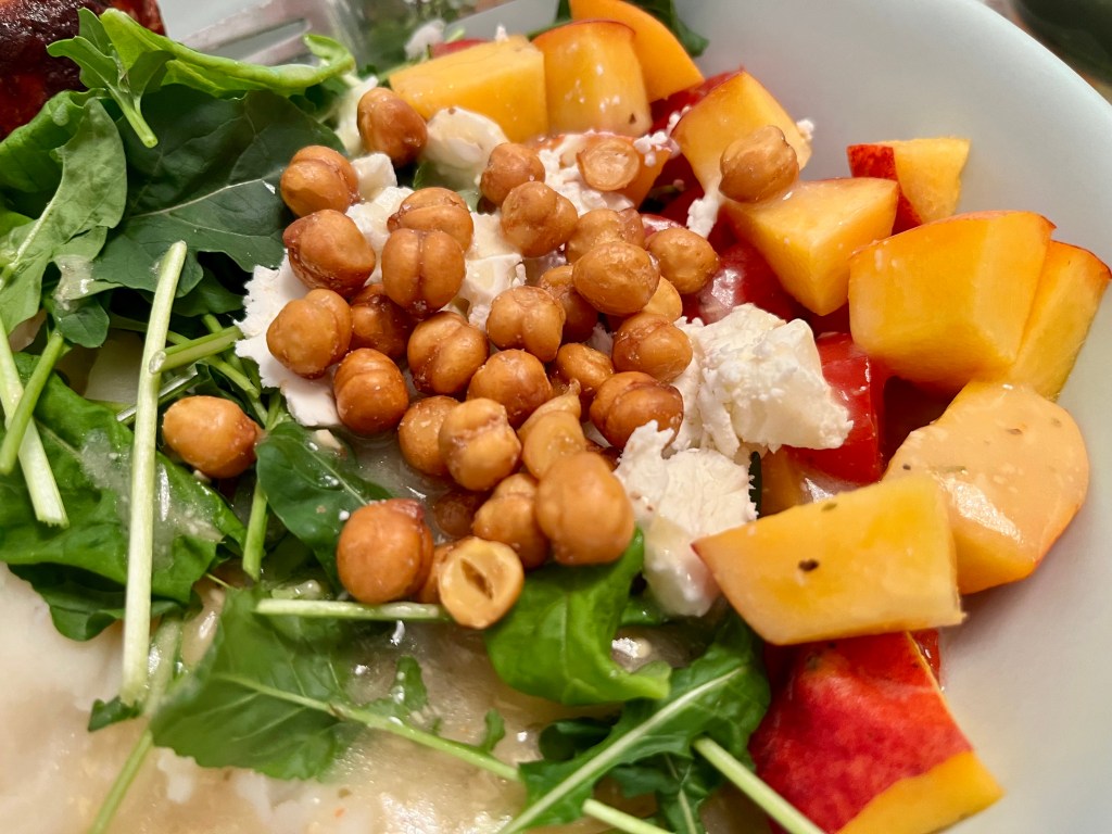 Arugula with goat cheese, chickpeas, peaches