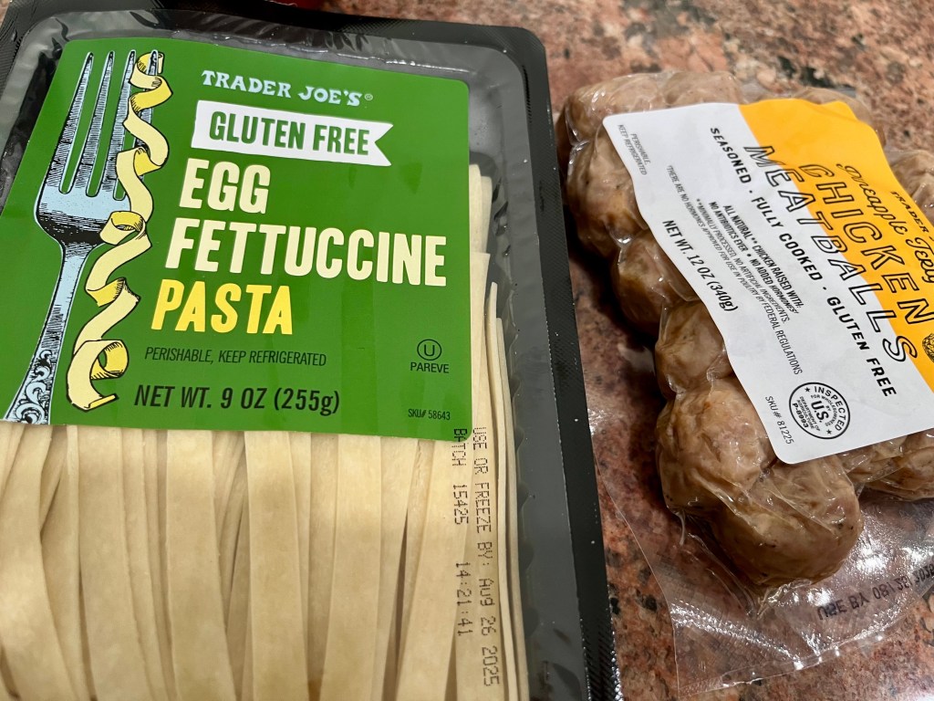 Trader Joe's gluten free egg fettuccine pasta and pineapple chicken meatballs.